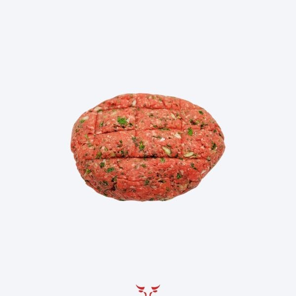 Beef kafta skewers with fresh parsley on butcher paper at Boucherie Beirut Laval