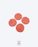 Beef burgers 4 pack hand-formed patties on butcher paper at Boucherie Beirut Laval