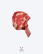 Cowboy steak tomahawk bone-in ribeye on butcher paper at Boucherie Beirut Laval