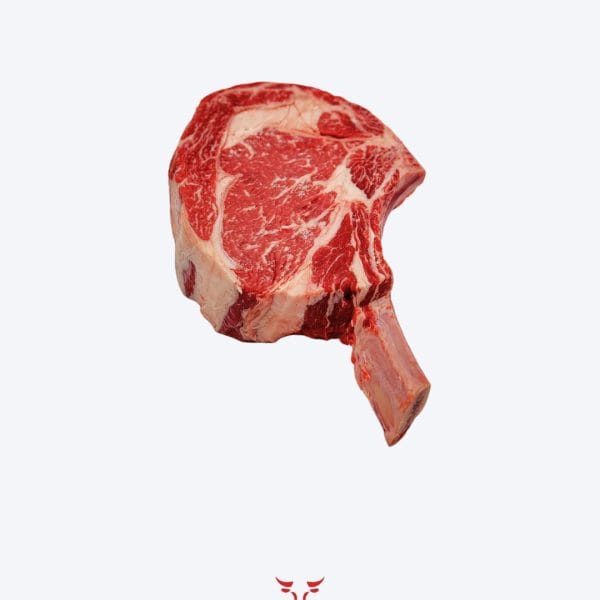 Cowboy steak tomahawk bone-in ribeye on butcher paper at Boucherie Beirut Laval