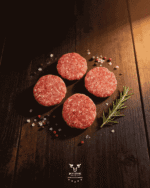Beef burgers 4 pack hand-formed patties on butcher paper at Boucherie Beirut Laval