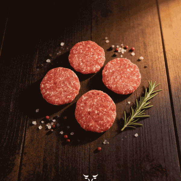 Beef burgers 4 pack hand-formed patties on butcher paper at Boucherie Beirut Laval