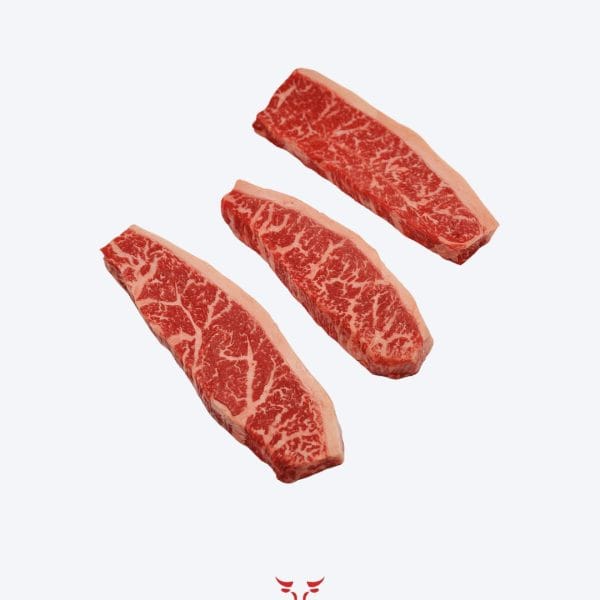 Wagyu 9+ striploin steak fullblood with extreme marbling on butcher paper at Boucherie Beirut Laval