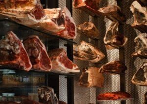 Freshly sliced halal beef displayed in butcher shop
