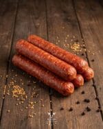 hotdog-beef-sausage-boucherie-beirutjpg | Boucherie Beirut Hotdog beef sausage with mustard seeds and black peppercorns on a rustic wooden surface – Boucherie Beirut Laval