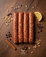 makanek-beef-sausage-boucherie-beirutjpg | Boucherie Beirut Makanek beef sausage with pine nuts cinnamon allspice and lemon on a rustic wooden surface – Boucherie Beirut Laval